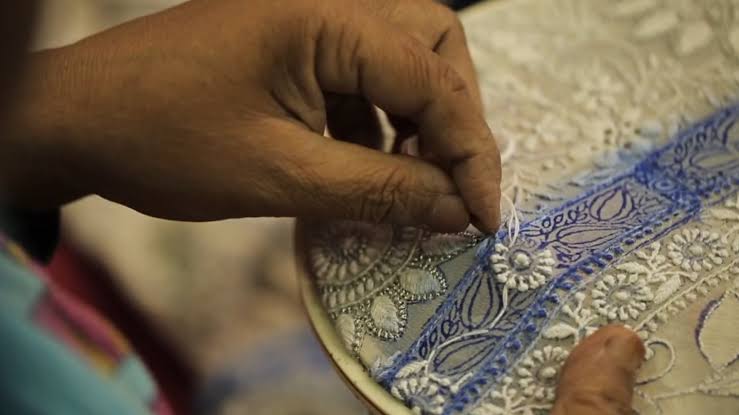 A Local Craftsman stiching a beautiful Lakhnavi Chikankari Kurti